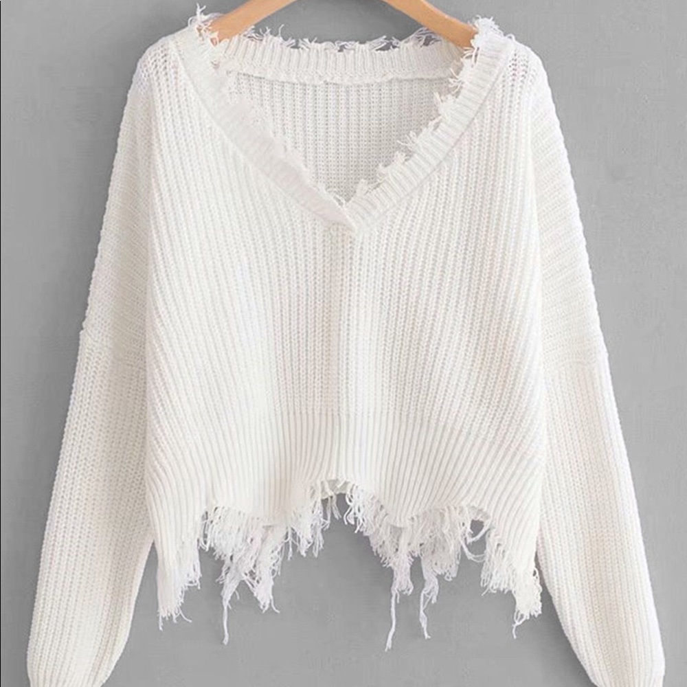 white frayed sweater